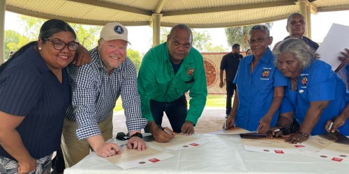 Minister for the Environment Matthew Swinbourn singing ILUA alongside Member for Kimberley Divina D'Anna and Miriuwung Gajerrong Corporation