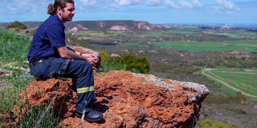 Man sitting on a rock overlooking Country
