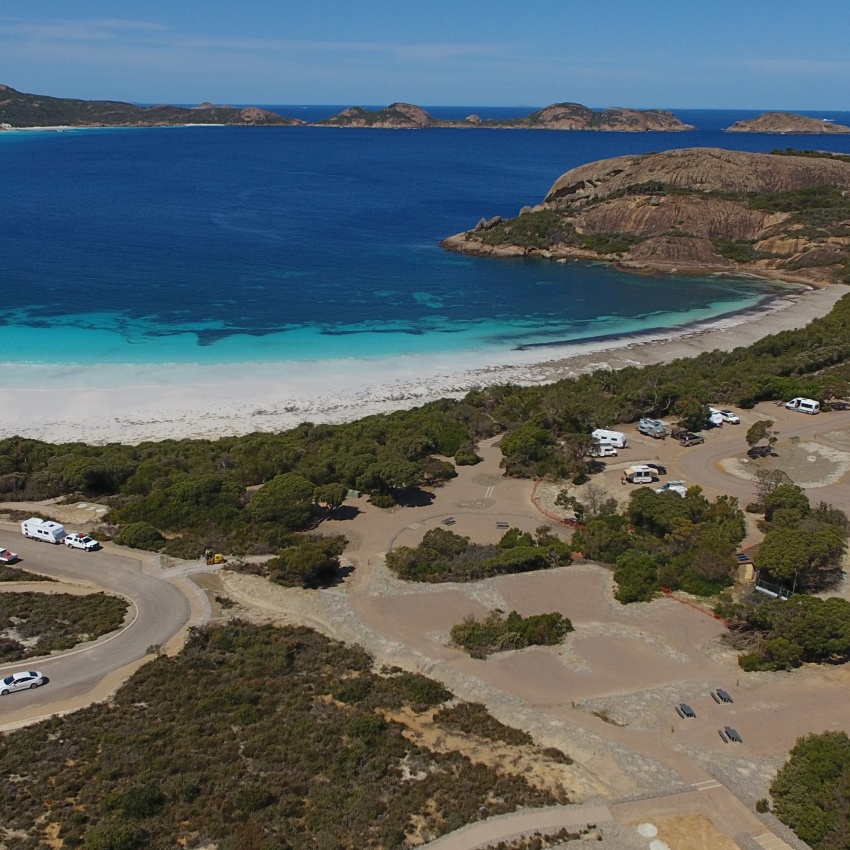 A campground with blue ocean in the background