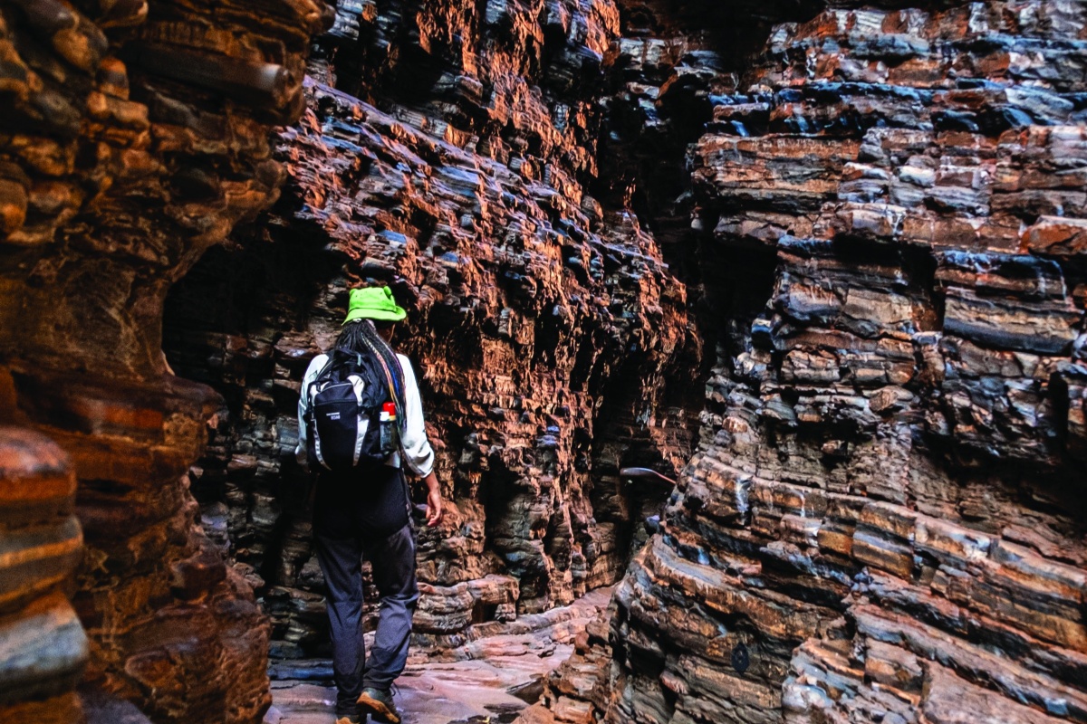 Person walking through Handrail Pool, Weano Gorge. Photo – Remi Bremont