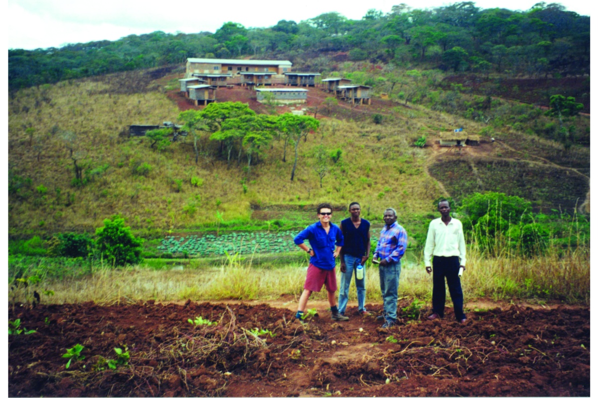 Josh Byrne standing in a filed in Milawi