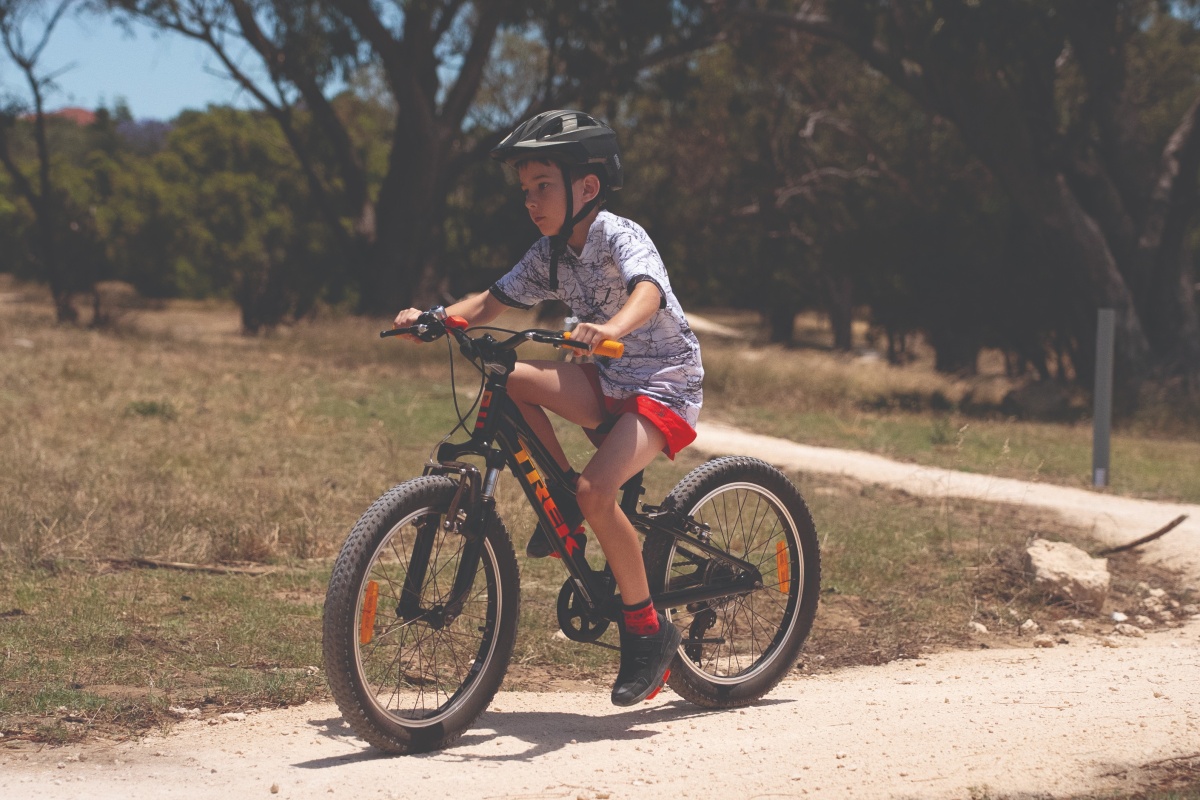 Young boy riding a bike on the trail. Photo – Miles Brotherson/DBCA 