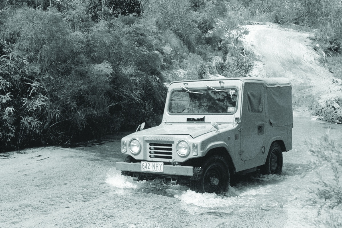 Vehicle driving through a creek
