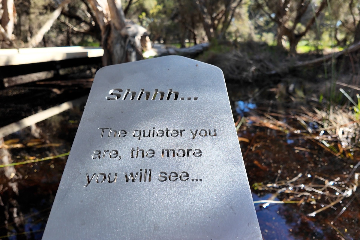 A sign reads "shh...the quieter you are, the more you will see"