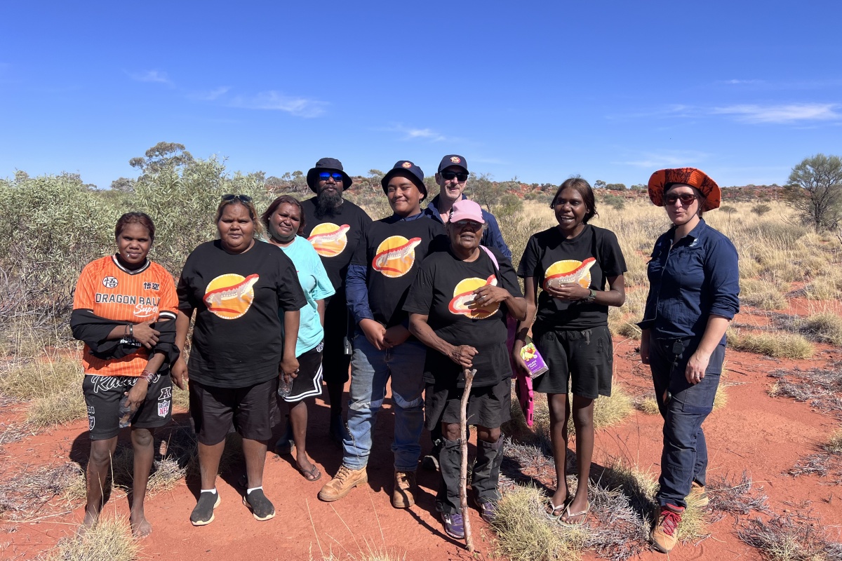 A group of rangers stand proudly in desert Country