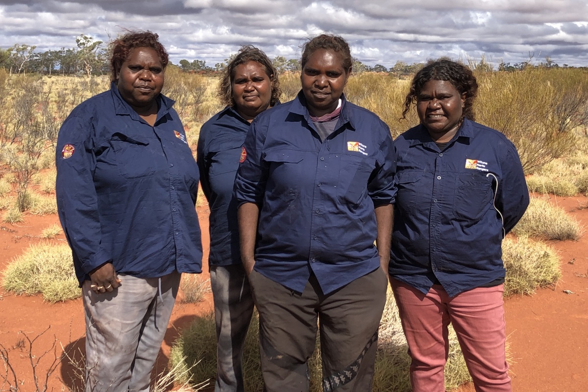 Four female rangers standing in desert Country