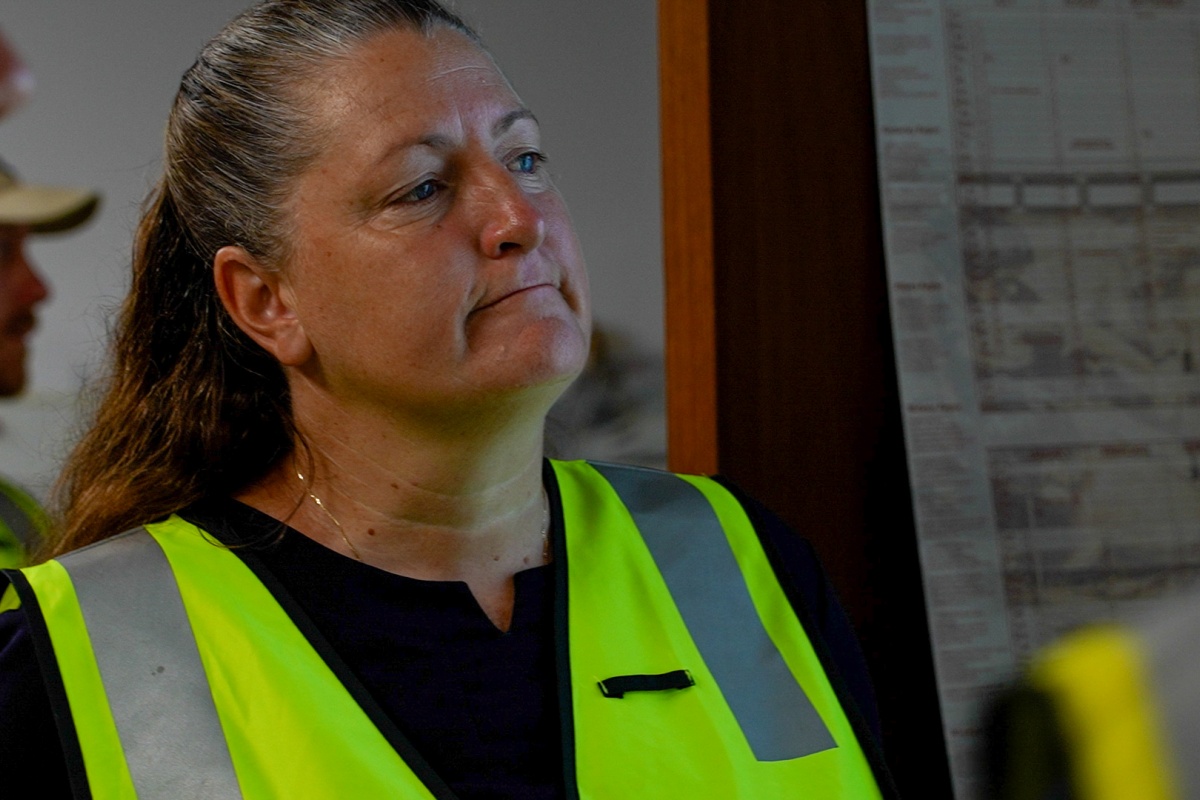 Allison looking at a screen thoughtfully