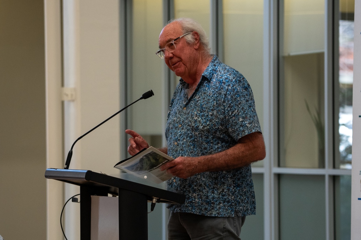 A man gives a speech at a podium